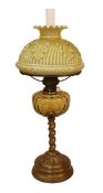 An Edwardian brass oil lamp with Toeb Elmann mechanism, yellow glass reservoir and opaque glass