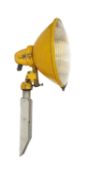 A 1950s yellow enamelled and aluminium floodlight, height 70cm. diameter 34cm