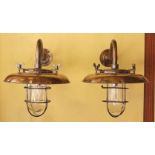 A pair of nautical style bronzed metal wall lights, height 35cm. diameter 35cm***CONDITION
