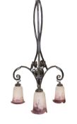 A 1920s French wrought iron three branch light fitting with marbled and frosted glass shades, height