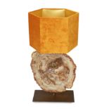 A bronze and petrified wood table lamp, height 60cm. width 28cm