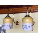 A pair of English brass gasolier wall lights with floral painted opaque wall glass shades, height