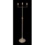 A lacquered brass three light lamp standard, with spiral fluted column and simulated candlestick