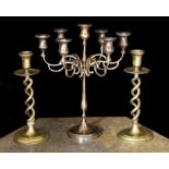 A pair of Victorian brass spiral twist candlesticks and a later seven light candelabrum,