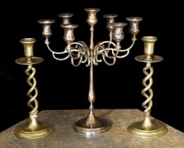 A pair of Victorian brass spiral twist candlesticks and a later seven light candelabrum,