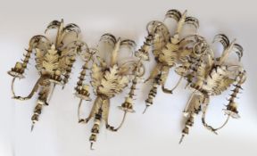 A set of four French white painted metal twin branch wall lights of foliate design, height 50cm.