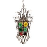 An early 20th century French wrought iron and coloured glass lantern of tapering hexagonal form,