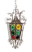 An early 20th century French wrought iron and coloured glass lantern of tapering hexagonal form,