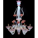 A 1950s Venetian pink and Vaseline glass six light chandelier with ornate flower and leaf motifs,