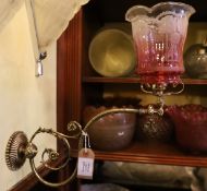 A Victorian brass gasolier wall light with cranberry tinted etched glass shade, now converted to