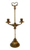 An early 20th century French ormolu adjustable twin branch candelabrum, with loaded base, height