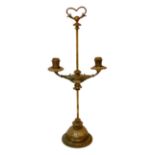 An early 20th century French ormolu adjustable twin branch candelabrum, with loaded base, height