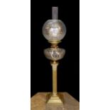 A late Victorian/Edwardian Corinthian column brass oil lamp, with cut glass reservoir, J.R.Roberts