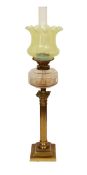 A late Victorian lacquered brass oil lamp with cut glass reservoir, Vaseline glass shade and flue,