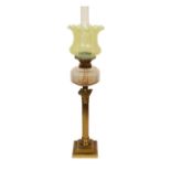 A late Victorian lacquered brass oil lamp with cut glass reservoir, Vaseline glass shade and flue,