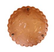 A 1930s French peach glass light bowl moulded with stylised leaves, with chain set and ceiling rose,