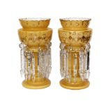 A pair of late 19th century Bohemian opaque glass lustres with enamelled and gilt floral decoration,