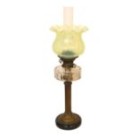 An Edwardian brass oil lamp with cut glass reservoir, Hinks No2 duplex mechanism, Vaseline shade and