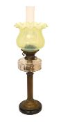 An Edwardian brass oil lamp with cut glass reservoir, Hinks No2 duplex mechanism, Vaseline shade and