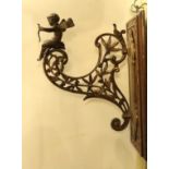 A late Victorian aesthetic movement ormolu wall bracket, modelled with Cupid and laurel leaves,