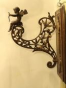 A late Victorian aesthetic movement ormolu wall bracket, modelled with Cupid and laurel leaves,