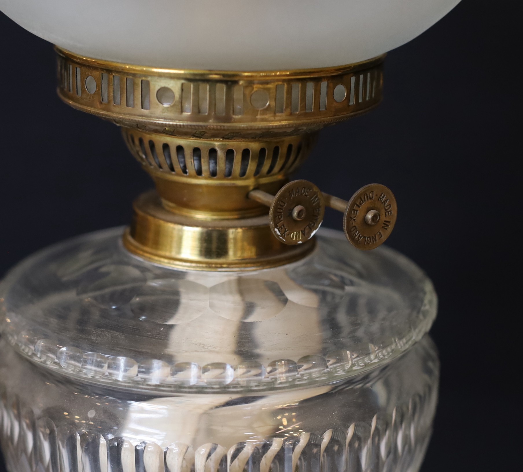 A late Victorian brass oil lamp with cut glass reservoir, duplex mechanism, etched glass globe and - Image 3 of 5