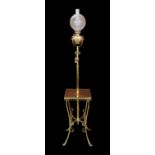 An Edwardian brass and copper telescopic oil lamp standard with scrolling underframe and etched