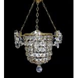 A 1930s lead crystal and brass bag shaped light fitting, height 53cm. width 36cm,