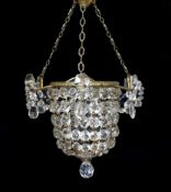 A 1930s lead crystal and brass bag shaped light fitting, height 53cm. width 36cm,