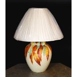 A 1930s English hand-painted pottery lamp base by Wait and Son of Midsham, Surrey, decorated with