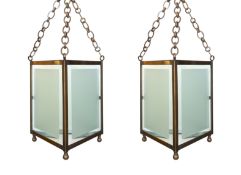 A pair of bronze and frosted glass triangular hall lanterns, height 36cm. width 33cm