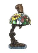 A bronze, stained glass and marble table lamp modelled as a flowering tree with parrot head,