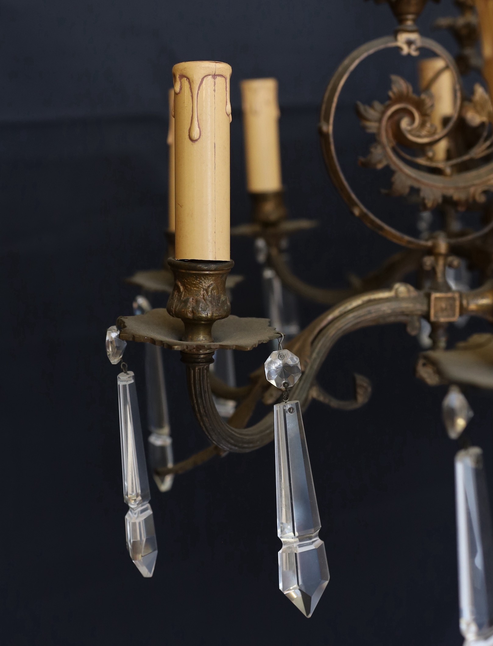 A Victorian bronze ten light gasolier with ornate scrolling foliate frieze and central ceramic stem, - Image 2 of 5