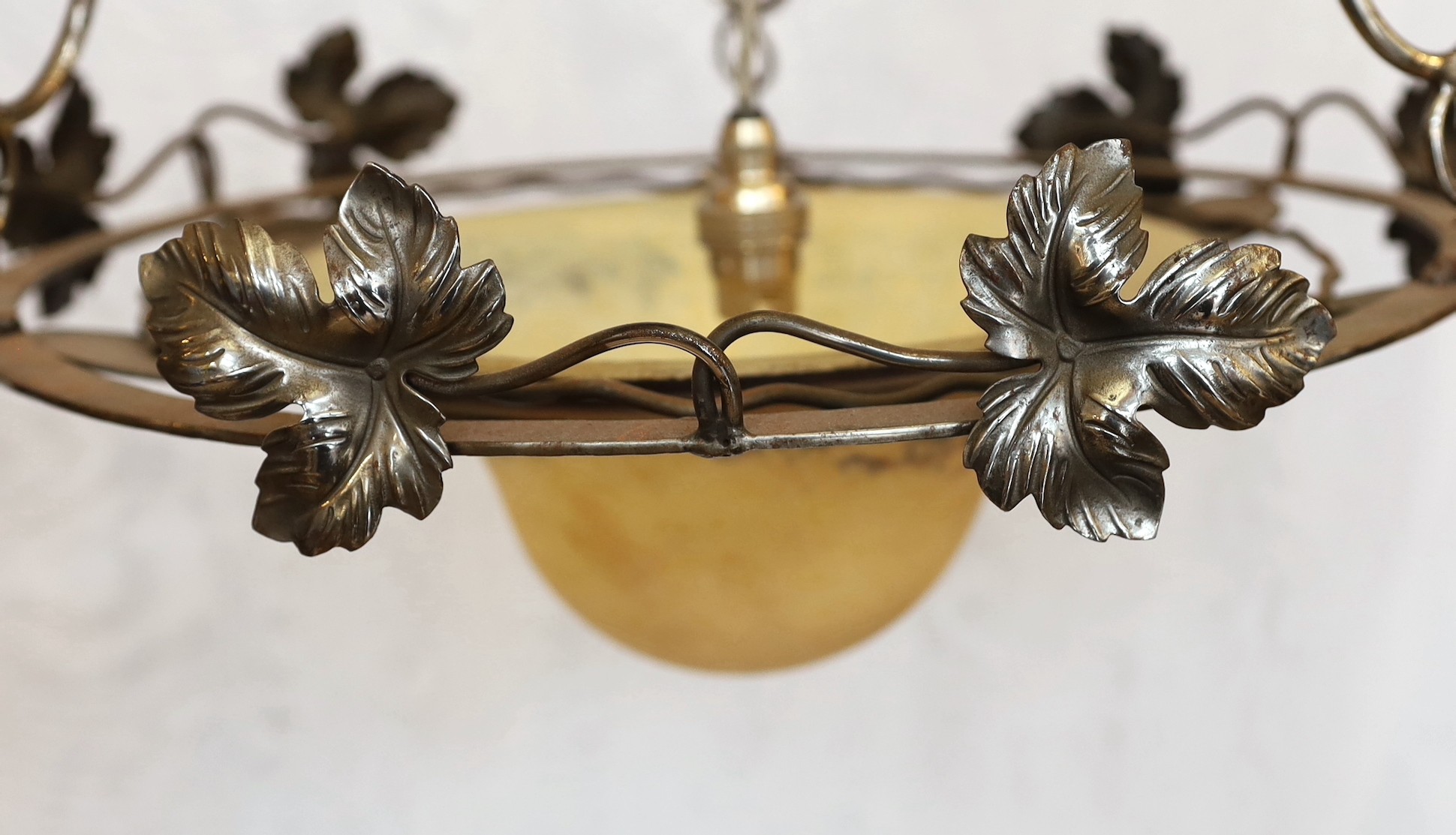 A 1920's-30's French polished wrought iron and marbled glass light fitting decorated with foliate - Image 3 of 5