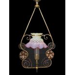 An English Arts & Crafts lacquered brass and copper gasolier with red tinted Vaseline glass shade,