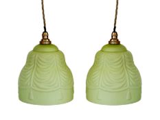 A pair of 1930s frosted green paint glass lampshades with pendant fittings, height 19cm, width