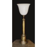 A 1950’s oxidised brass column table lamp with opaque white glass uplighter shade, height overall