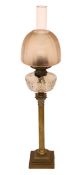 An Edwardian brass Corinthian column oil lamp with cut glass reservoir, improved duplex mechanism,