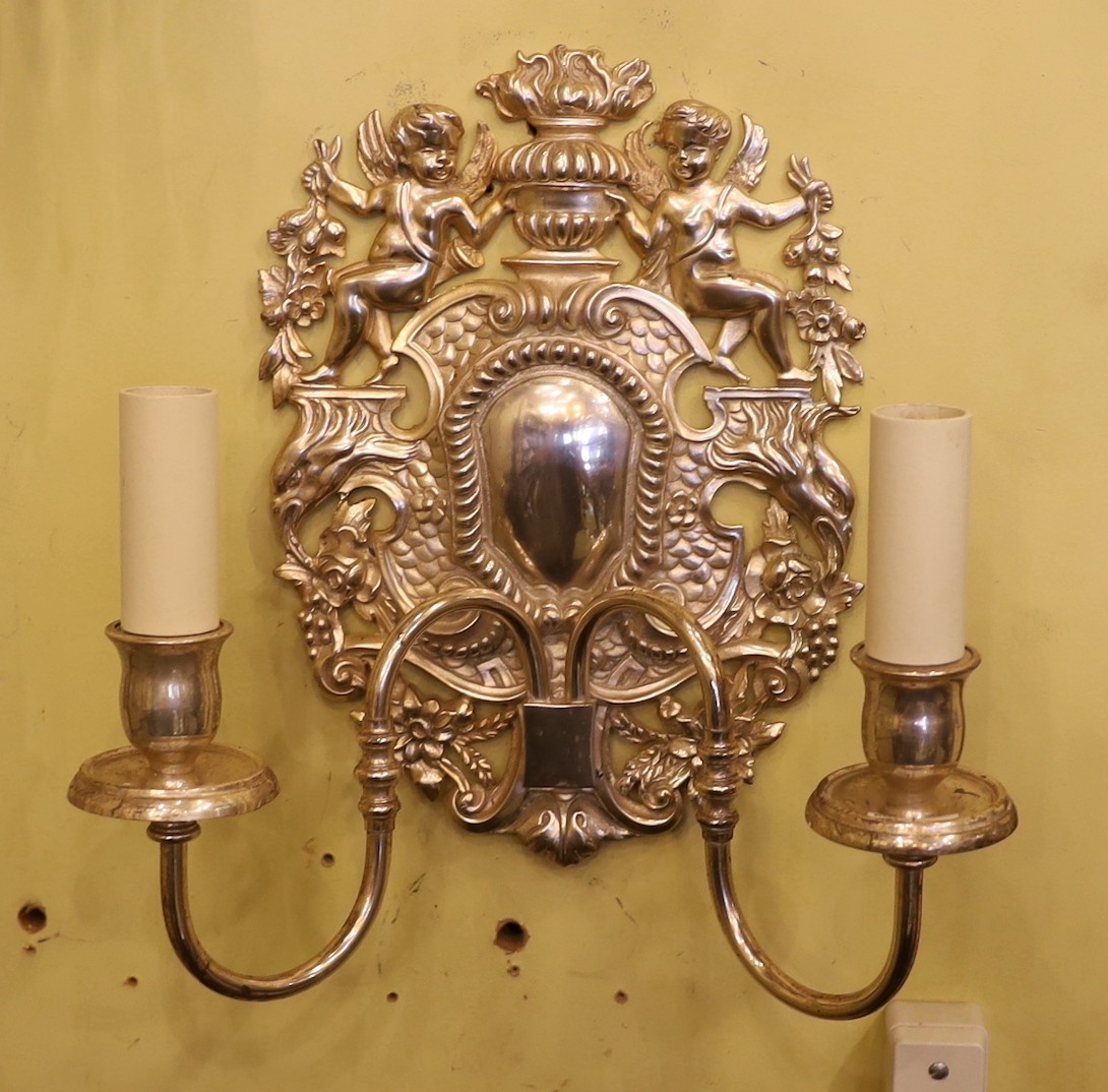 A pair of 17th century style silver plated wall lights with cherub and flower back plates and scroll - Image 2 of 2