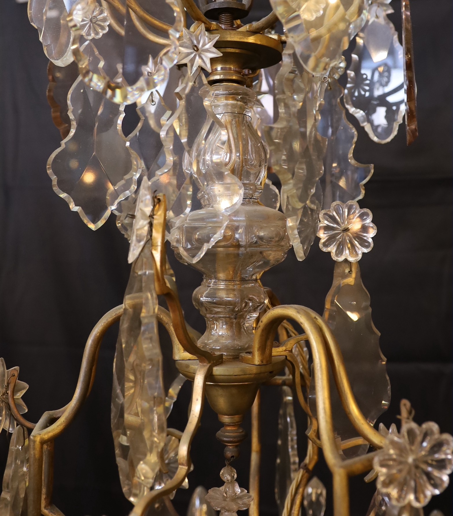 An early 20th century French gilt bronze and cut glass eight light chandelier profusely hung with - Image 4 of 4