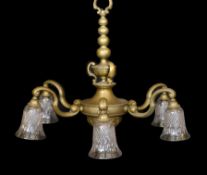 An early 20th century English bronze six light chandelier with cut glass shades, drop 70cm. width