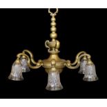 An early 20th century English bronze six light chandelier with cut glass shades, drop 70cm. width