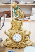 A French gilt metal figural mantel clock, 48cms high