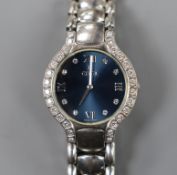 A lady's modern stainless steel Ebel quartz wrist watch and bracelet with diamond set dial and