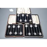 Three assorted cased sets of six silver bean end coffee spoons.