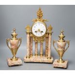 A French gilt metal and marble clock garniture, 38cm