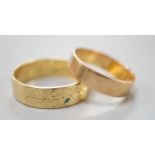 An engraved 18ct gold wedding band, size Q, 5.2 and a yellow metal band, 3.2 grams.