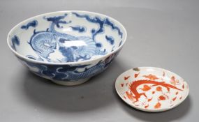 A 19th century Chinese ‘dragon’ bowl, together with a smaller ‘dragon’ dish. Largest 18.5cm