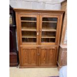 A Victorian glazed pitch pine four door school cabinet, width 146cm, depth 36cm, height 199cm