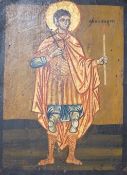 Greek School, tempera on wooden panel, Icon of a standing saint holding a candle, 33 x 24.5cm